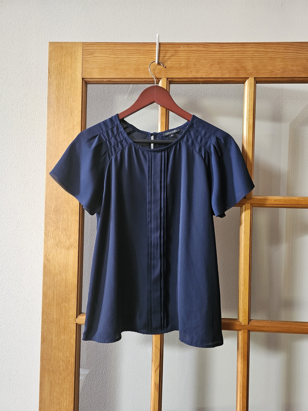 Navy Pintuck Flutter Blouse